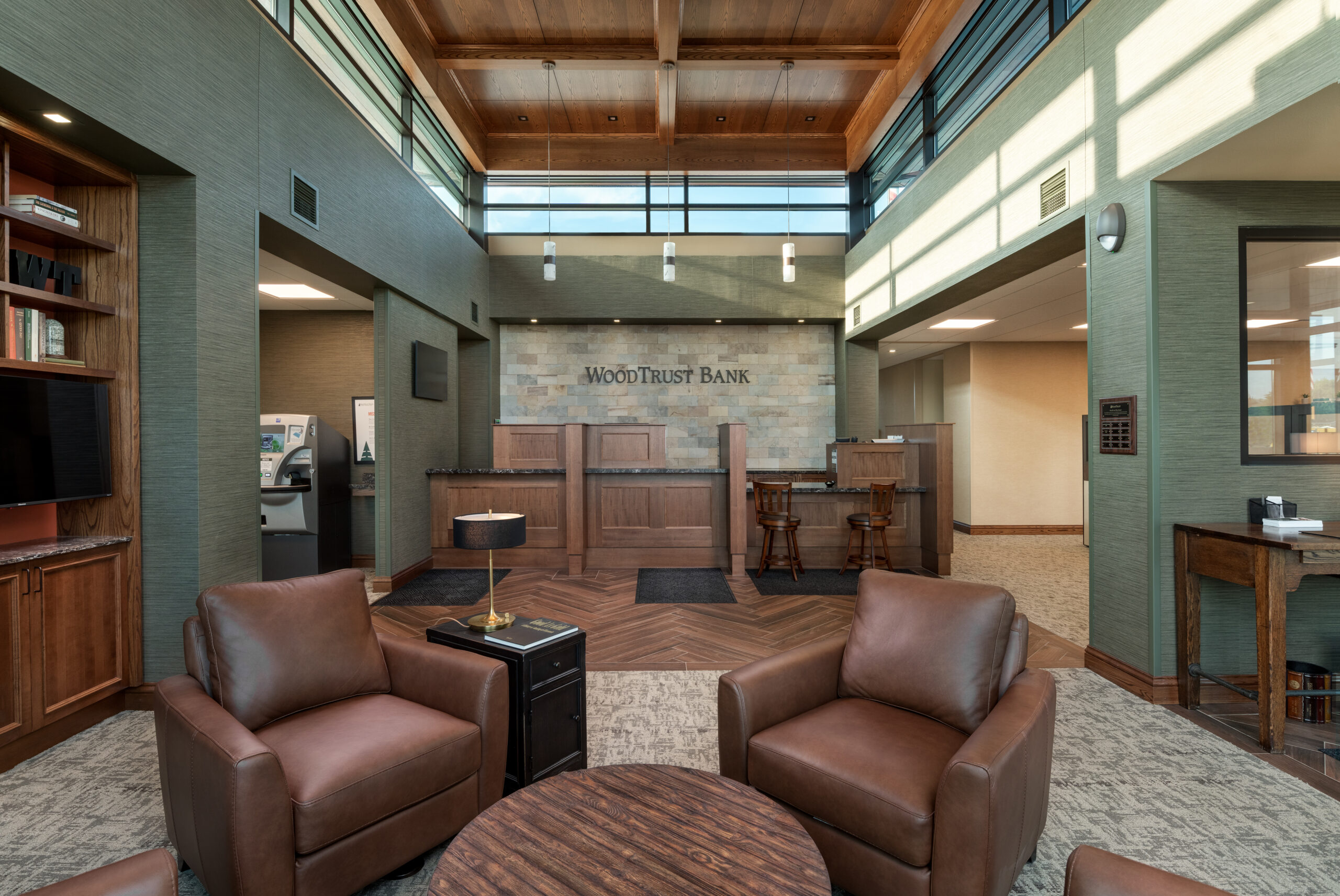 bank2 An inviting lobby scene with two chairs and a table, offering a cozy space for relaxation and social interaction